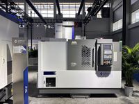 Токарный станок SMTCL iT35L, вид спереди: серая дверь рабочей зоны с решёткой и пульт ЧПУ